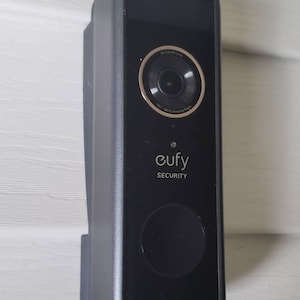 May include: A black Eufy Security doorbell camera with a 2K Full HD lens and a 160° wide viewing angle.