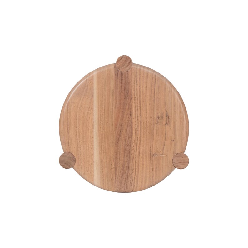 May include: A round wooden serving board with a natural wood grain finish. The board has three small, rounded feet. The board is approximately 12 inches in diameter, perfect for serving appetizers or small dishes.
