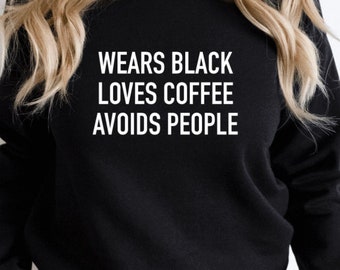 Wears black, loves coffee, avoids people.