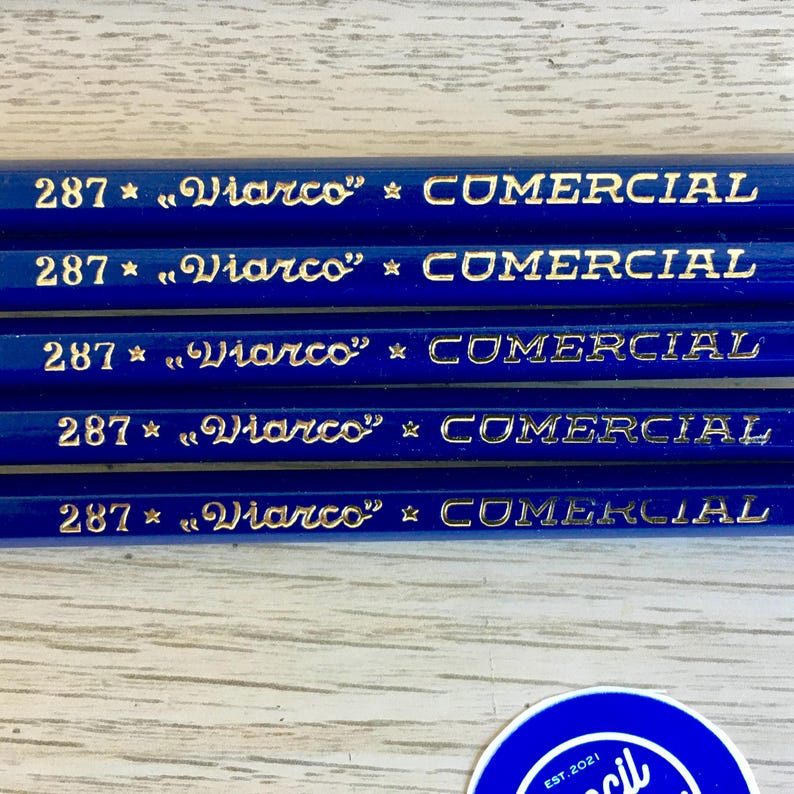 Puede incluir: Cinco l&aacute;pices azules con letras doradas que dicen "287 * "Viarco" * COMERCIAL".