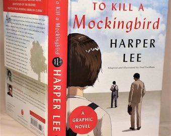 May include: A graphic novel adaptation of "To Kill a Mockingbird" by Harper Lee. The cover features the title in red, the author's name, and an illustration of three figures. The spine is red with the title and author's name.