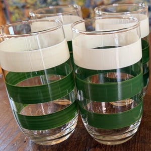 May include: A set of three ceramic vases in varying sizes. The vases are white with a textured, ribbed design. The tallest vase is approximately 10 inches tall. The other two are slightly smaller, creating a tiered display.