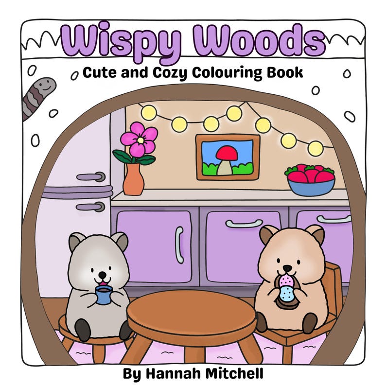 May include: A cartoon illustration of a coloring book cover titled "Wispy Woods: Cute and Cozy Colouring Book." Two bear-like characters sit at a table. The scene includes a kitchen setting with a framed mushroom picture and a string of lights.