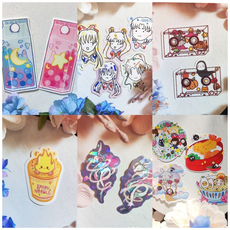 May include: A collection of colorful stickers featuring various characters and designs. There are stickers of anime characters, a cartoon ramen bowl, a Totoro character, and a cassette tape with a Totoro character inside. The stickers are on a white background.