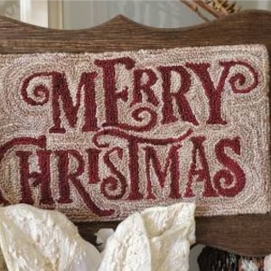May include: A wooden sign with a beige background and red lettering that reads "Merry Christmas".