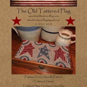 May include: A wooden box with a decorative textile featuring red, white, and blue stars. The text reads "Tattered Stars" and "Finished Size 5 inches x 10 inches". The Old Tattered Flag logo is at the top.