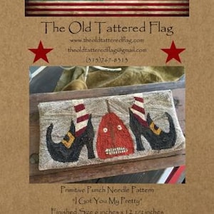 May include: Primitive punch needle pattern for a "I Got You My Pretty" witch shoe design. The finished size is 8 inches by 12 1/2 inches. The pattern is adapted from the folk art of Lisa Evans Folk for All Seasons.