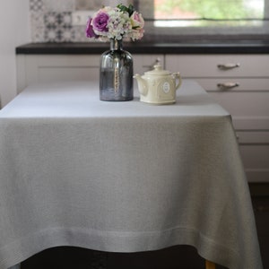 Luxury linen tablecloth hand-woven on ancient wooden looms. Sizes - rectangle, square. Color- light bluish grey.