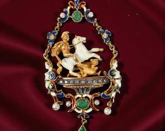 May include: Ornate pendant featuring a gold-toned scene of a figure on a white horse, with a golden dog. The pendant has blue, red, and white enamel accents, emerald and pearl embellishments, and a teardrop-shaped emerald drop.