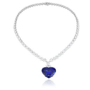 May include: A heart-shaped sapphire pendant necklace with a diamond chain. The sapphire is a deep blue color and the diamonds are clear.