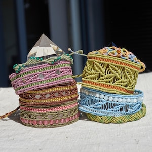 May include: A set of three ceramic mugs with a speckled, matte finish. The mugs are in shades of cream, light gray, and dark gray. Each mug has a simple, minimalist design, perfect for coffee or tea.