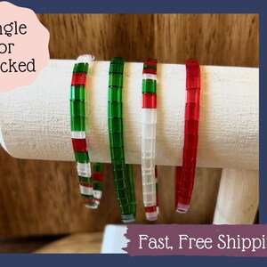 May include: Four beaded bracelets in red, white, and green colors. The bracelets can be worn individually or stacked together.  Single or Stacked. Fast, Free Shipping.