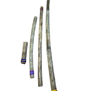 May include: Four wooden didgeridoos of varying lengths, each with a natural, textured finish. The didgeridoos are adorned with colorful bands of blue, purple, and yellow-red ribbon near the ends. The instruments are arranged against a white background.