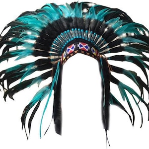 May include: A turquoise and black feather headdress with colorful beaded trim. The headdress is a traditional Native American style.