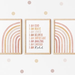 May include: Three framed prints with a watercolor rainbow design. The middle print has the text "I am kind, I am brave, I am loved, I am helpful, I am important, I am amazing, I am enough, I am Rachel".