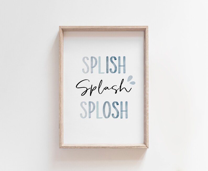 May include: A framed print with the words "Splish Splash Splosh" in a blue watercolor gradient. The words are in a playful font and are perfect for a bathroom or nursery.