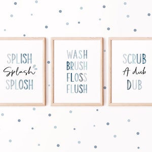 May include: Three framed prints with blue and white watercolor text. The first print says "Splish Splash Splosh", the second says "Wash Brush Floss Flush", and the third says "Scrub A Dub Dub".