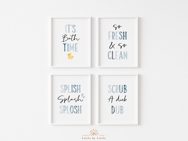 May include: Four white framed prints with blue and white watercolor backgrounds and black text. The prints read "It's Bath Time" with a yellow rubber duck, "So Fresh & So Clean", "Splish Splash Splosh", and "Scrub A Dub Dub".