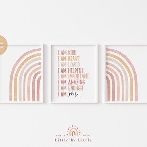 May include: Three framed prints with a watercolor rainbow design. The center print features the text "I am kind, I am brave, I am loved, I am helpful, I am important, I am amazing, I am enough, I am Mila".