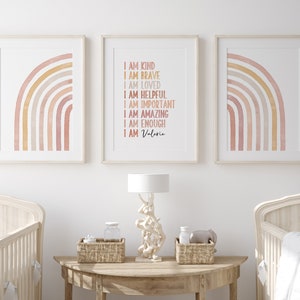 May include: Three framed prints with a watercolor rainbow design. The center print has the text "I am kind, I am brave, I am loved, I am helpful, I am important, I am amazing, I am enough, I am Valeria".