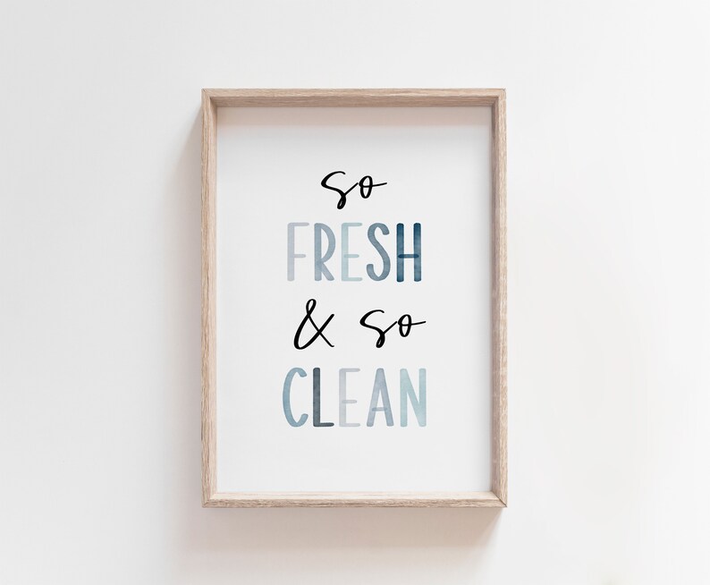May include: A framed print with the text "So Fresh & So Clean" in a blue watercolor style.