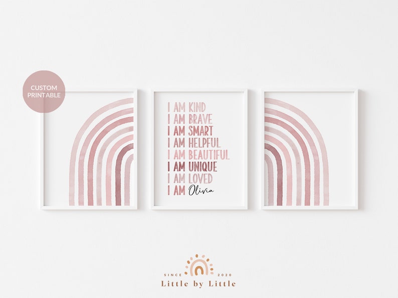 May include: Three printable wall art prints featuring a pink watercolour rainbow design. The middle print has the text "I am kind, I am brave, I am smart, I am helpful, I am beautiful, I am unique, I am loved, I am Olivia".