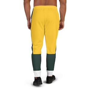 May include: Yellow and green sweatpants with white stripes down the sides. The sweatpants have a drawstring waistband and a relaxed fit.