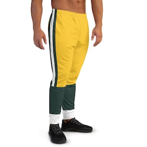 May include: Yellow and green sweatpants with white stripes down the sides. The sweatpants have a white waistband and a white cuff at the bottom.