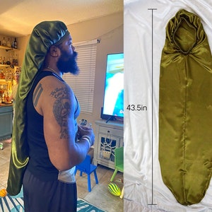 May include: A long, olive green satin bonnet with a drawstring closure. The bonnet is 43.5 inches long.