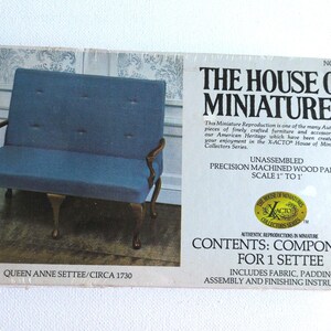 May include: A miniature Queen Anne settee kit from The House of Miniatures. The box features a blue upholstered seat with wooden arms and legs. The kit includes fabric, padding, and assembly instructions. Scale is 1" to 1'.