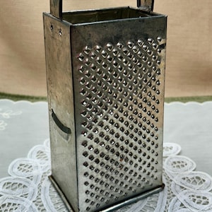 May include: A handmade wooden sign with the text "Welcome" in a playful font. The sign is painted white with a distressed finish, and features a decorative floral design in shades of pink and green. Includes a jute rope for hanging.