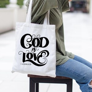 Scripture, 1 John 4:9 - God Is Love - Bible Verse, SVG Cut File, scripture svg, Christian svg, handlettered svg, for cricut