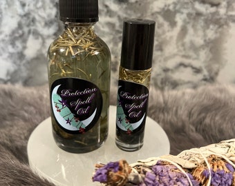 May include: Two bottles of Protection Spell Oil, one in a dropper bottle and one in a roller bottle. Both bottles are clear and contain a green liquid with herbs. The bottles are on a white surface with a bundle of dried sage.