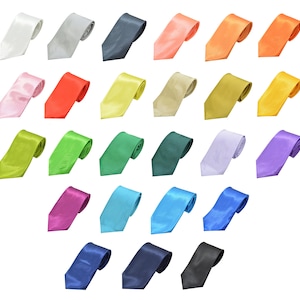 May include: A collection of 20 solid color satin neckties in various colors, including black, white, red, blue, green, yellow, and purple.