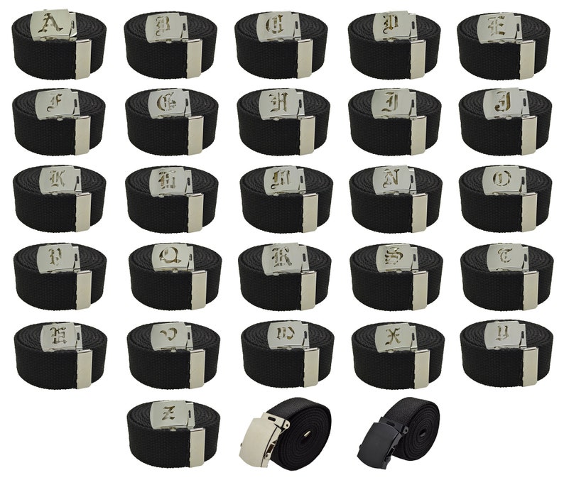May include: Set of 26 black canvas belts with silver buckles, each featuring a different letter of the alphabet in a gothic font. The belts are arranged in alphabetical order. There are also two additional belts with black buckles.