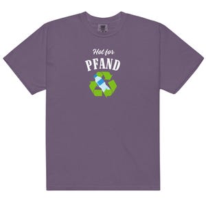 May include: A purple t-shirt with the words "Hot for Pfand" above a recycling symbol containing a water bottle. The shirt is made of a soft material and has a classic crew neck.