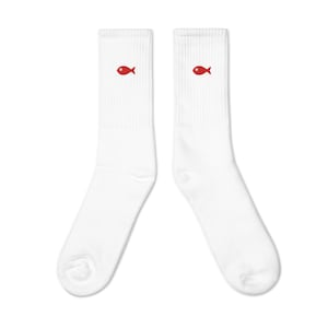 May include: A pair of white socks with a small red fish design on each sock.