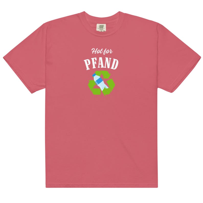 May include: A coral-colored t-shirt with the words "Hot for Pfand" above a recycling symbol with a water bottle inside. The shirt is made of a soft material and has short sleeves.