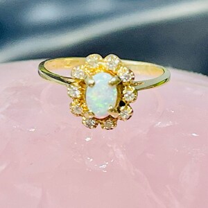 Neptune Opal 14k ring, 2.3 Gram Size 5.25. Free Sizing