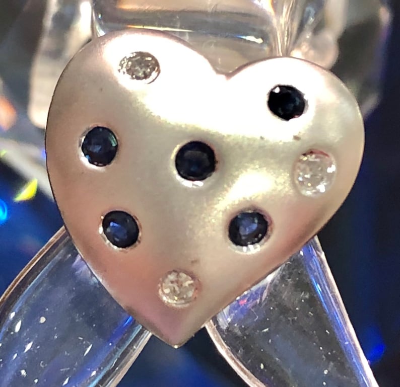 Heart Pendant 10k white gold with 5 Blue Sapphires and 3 diamonds.