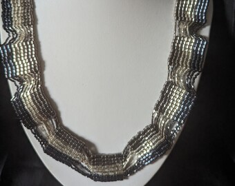 Grey pewter and silver collar necklace.
