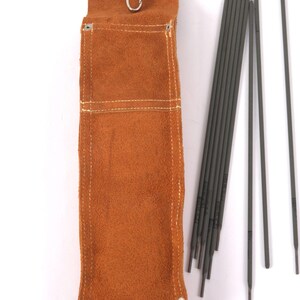 Leather Welding Rod Pouch | Handmade Welder Rod Holder,  A brown leather welding rod holder with a metal clasp, next to a bundle of gray welding rods. The holder has white stitching and metal rivets at the bottom.