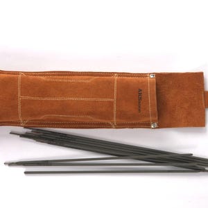 May include: Leather Welding Rod Pouch | Handmade Welder Rod Holder, flap and a metal clasp. The holder is open, revealing several dark gray welding rods. The text "ARS WELDING" is visible on the holder.