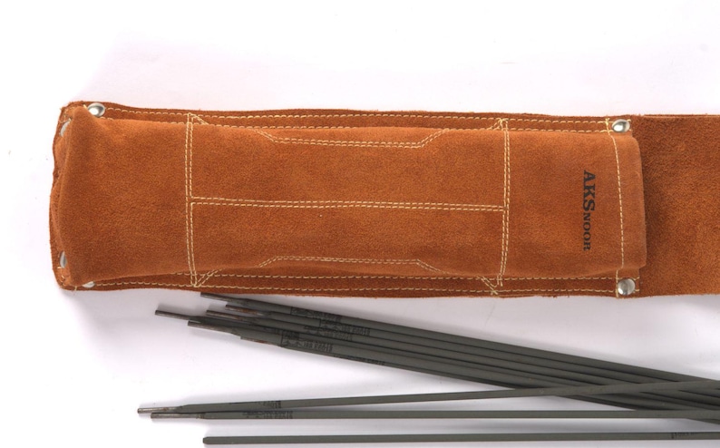 Leather Welding Rod Pouch | Handmade Welder Rod Holder, A brown leather welding rod holder with the text "AKS Noor" and several welding rods. The holder has a rectangular design with white stitching and metal rivets. The welding rods are dark gray.