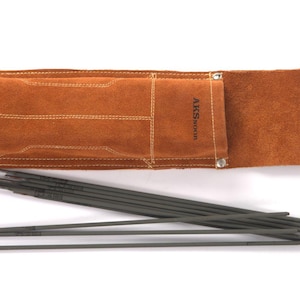 Leather Welding Rod Pouch | Handmade Welder Rod Holder a brown leather welding rod holder with the text "AKSNOOR" and a silver clasp. Several dark gray welding rods are fanned out in front of the holder. The holder is rectangular and has white stitching.