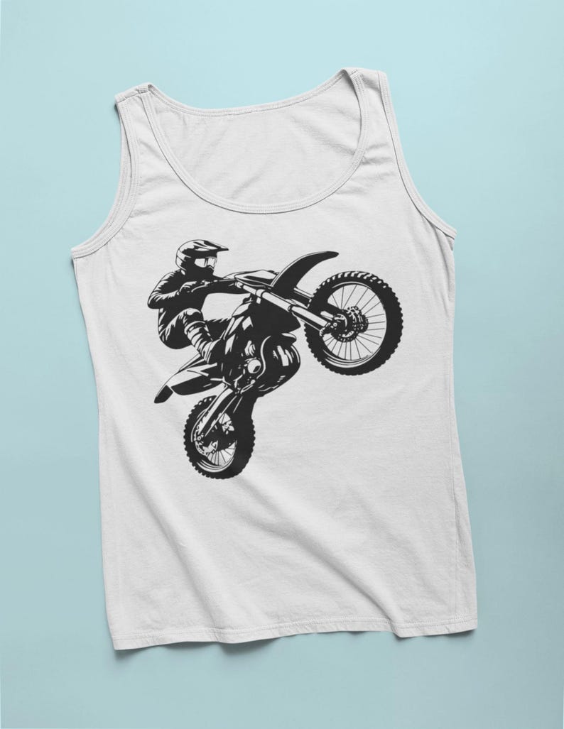 May include: A white tank top with a black silhouette of a motocross rider performing a wheelie on their dirt bike.