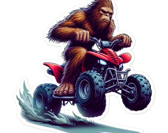 Può includere: Un adesivo raffigurante un Bigfoot marrone che guida un quad rosso. Il Bigfoot ha un'espressione seria e tiene il manubrio. Il quad ha pneumatici neri e solleva una nuvola di polvere, suggerendo velocità e avventura.