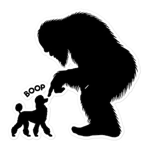 May include: Black and white sticker featuring a silhouette of Bigfoot pointing at a poodle. The word "BOOP" is above the poodle. The sticker has a white border.