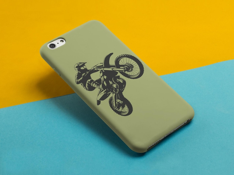 May include: A green phone case with a black silhouette of a motocross rider performing a wheelie.