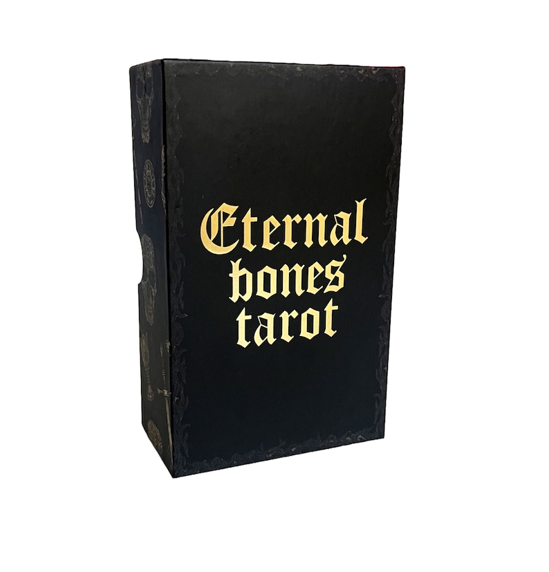 May include: Black box with gold lettering that reads "Eternal Bones Tarot".